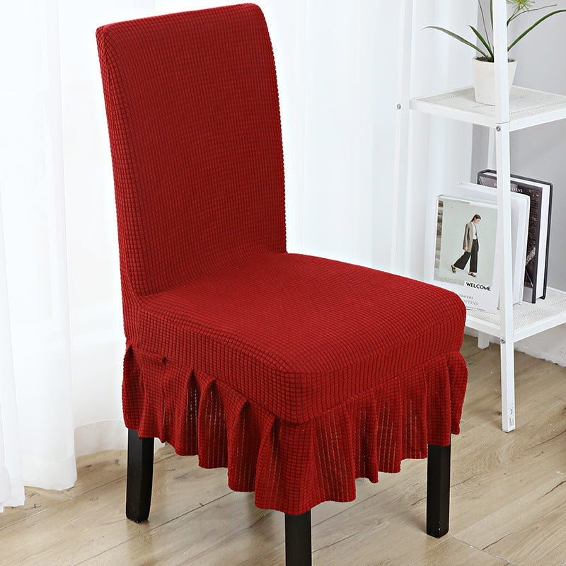 The chair cover has a skirt, is thick, stain-resistant, and elastic.