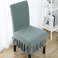 The chair cover has a skirt, is thick, stain-resistant, and elastic.