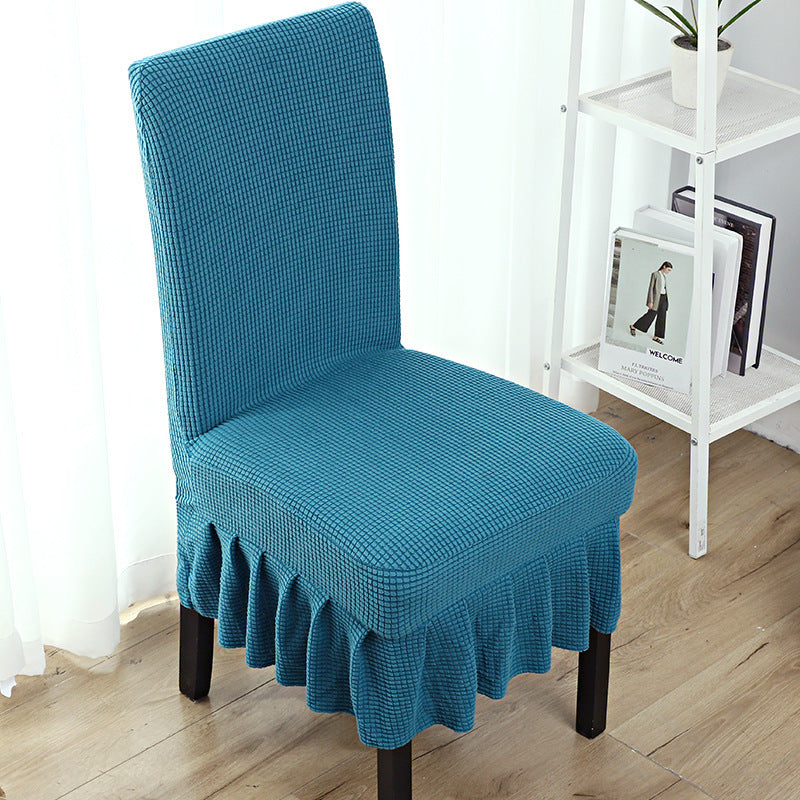 The chair cover has a skirt, is thick, stain-resistant, and elastic.
