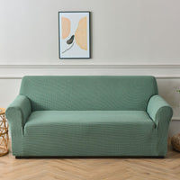 Sofa cover made of waterproof elastane material.