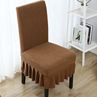 The chair cover has a skirt, is thick, stain-resistant, and elastic.
